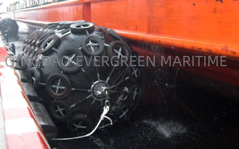 Pneumatic rubber fender installed for ship berthing operations